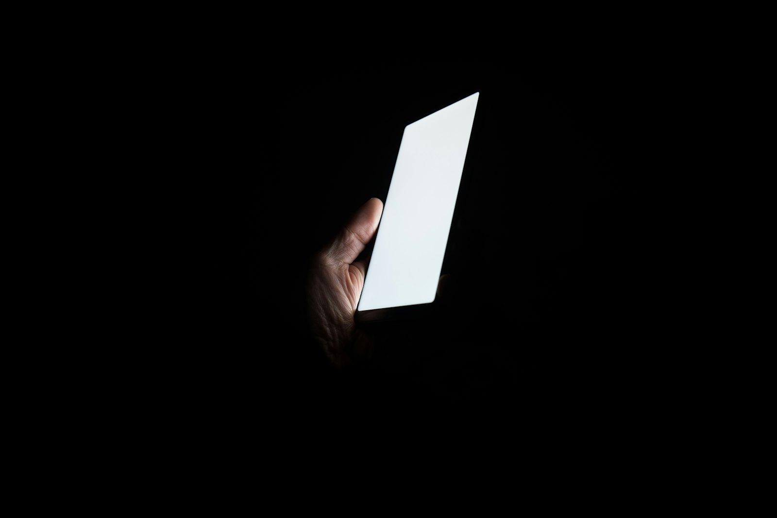 Meta social media settlement and a teenager using a smartphone at night
